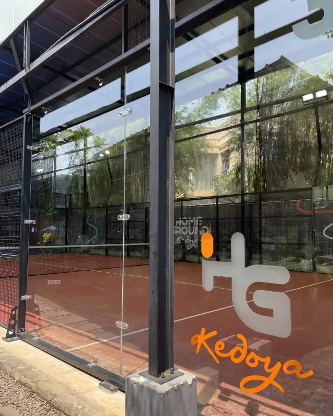 HG Kedoya monogram on terracotta court glass
