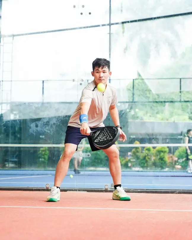 A junior player ready on court