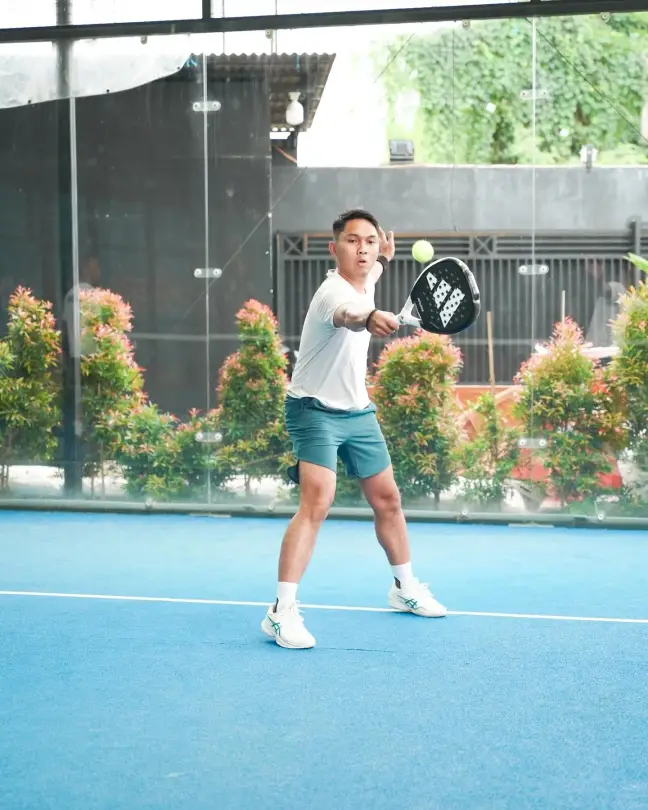 A player hitting a forehand