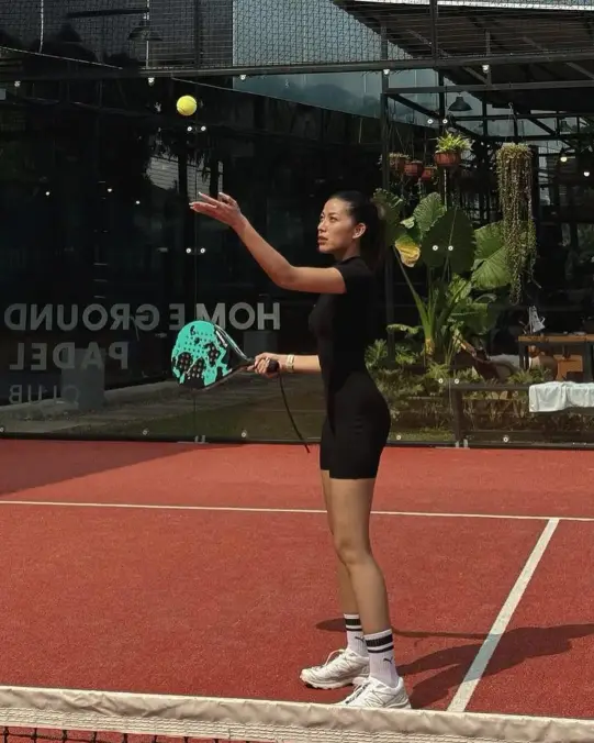 A player serving on terracotta